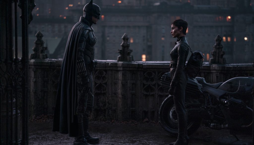 Caption: (L-r) ROBERT PATTINSON as Batman and ZOË KRAVITZ as Selina Kyle in Warner Bros. Pictures’ action adventure “THE BATMAN,” a Warner Bros. Pictures release. Photo Credit: Jonathan Olley/™ & © DC Comics