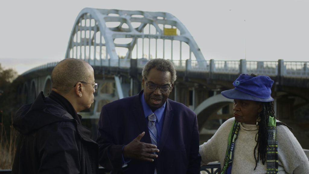 Left to Right: Jeffery Robinson with Senator Hank Sanders and Faya Ora Rose Toure in Who We Are. Photo by Jesse Wakeman. Courtesy of Sony Pictures Classics