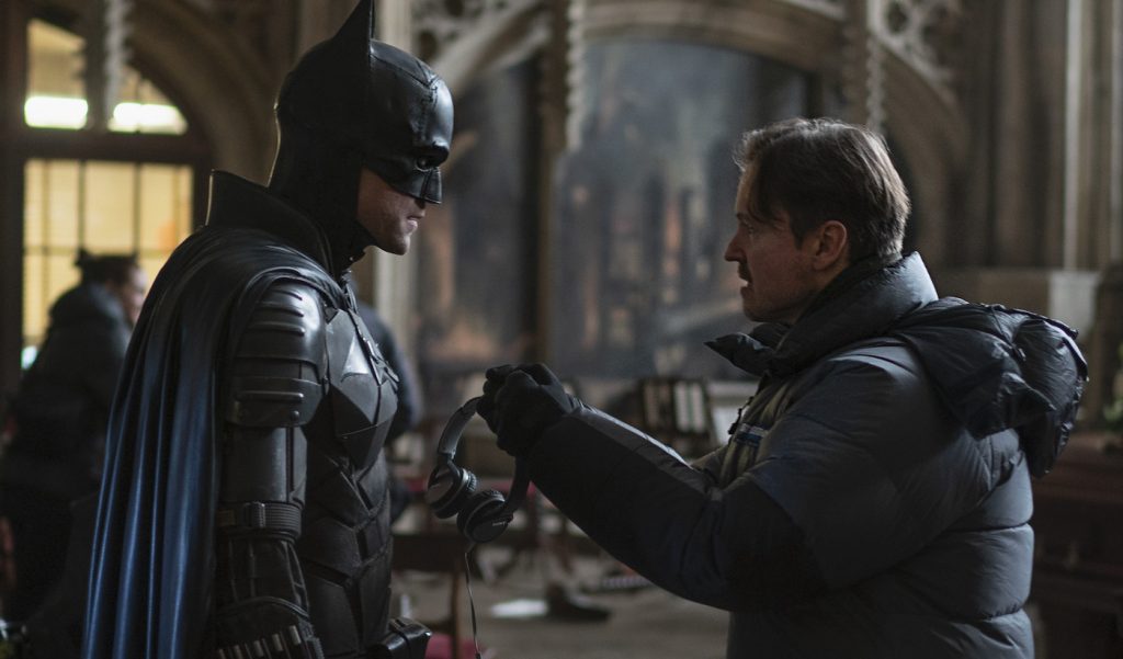 Caption: (L-r) ROBERT PATTINSON and director MATT REEVES and on the set in Warner Bros. Pictures’ action adventure “THE BATMAN,” a Warner Bros. Pictures release. Photo Credit: Jonathan Olley/™ & © DC Comics