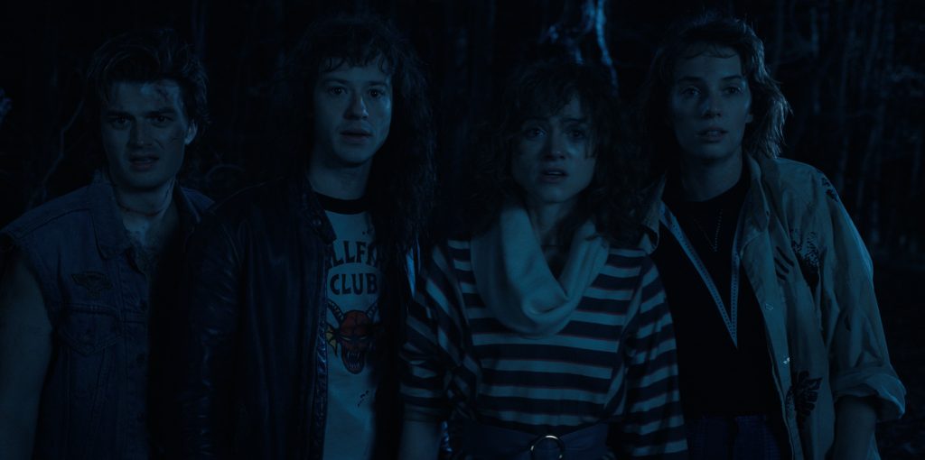 STRANGER THINGS. (L to R) Joe Keery as Steve Harrington, Joseph Quinn as Eddie Munson, Natalia Dyer as Nancy Wheeler, and Maya Hawke as Robin Buckley in STRANGER THINGS. Cr. Courtesy of Netflix © 2022