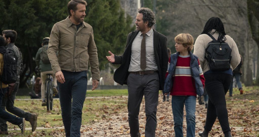 The Adam Project (L to R) Ryan Reynolds as Big Adam, Mark Ruffalo as Louis Reed and Walker Scobell as Young Adam. Cr. Doana Gregory/Netflix © 2022
