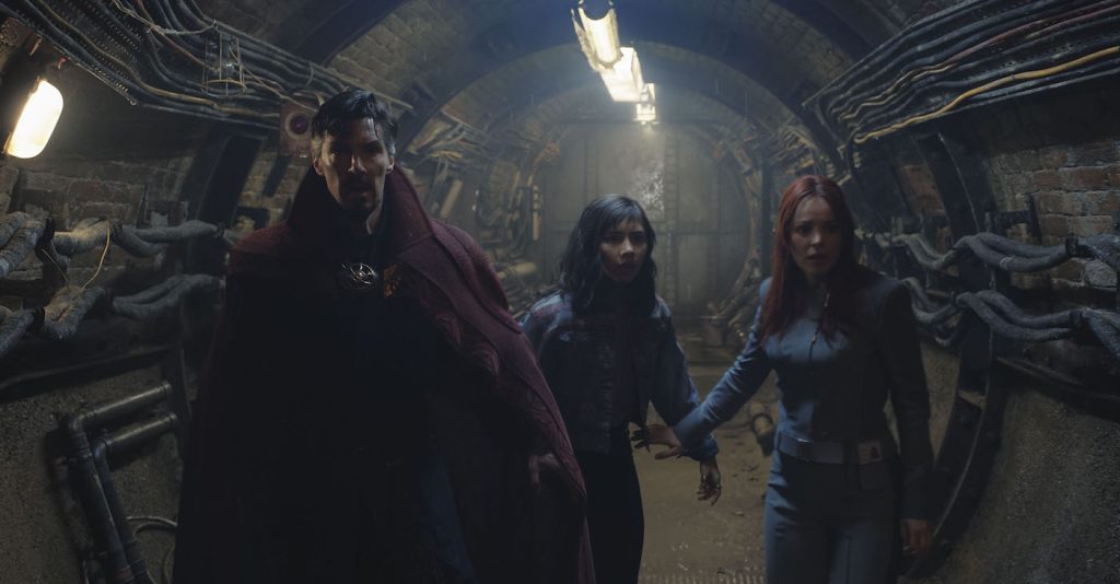 Benedict Cumberbatch as Dr. Stephen Strange, Xochitl Gomez as America Chavez, and Rachel McAdams as Dr. Christine Palmer in Marvel Studios' DOCTOR STRANGE IN THE MULTIVERSE OF MADNESS. Photo courtesy of Marvel Studios. ©Marvel Studios 2022. All Rights Reserved.