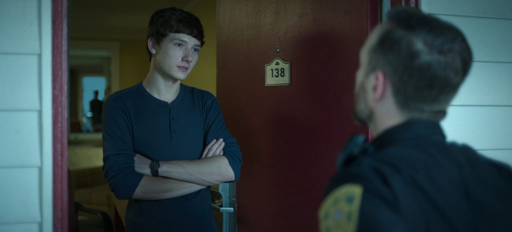 Ozark. (L to R) Skylar Gaertner as Jonah Byrde, David Bradley Carter as Deputy Ronnie Wycoff in Season 4 Part 2 Episode 3 of Ozark. Cr. Courtesy of Netflix © 2022