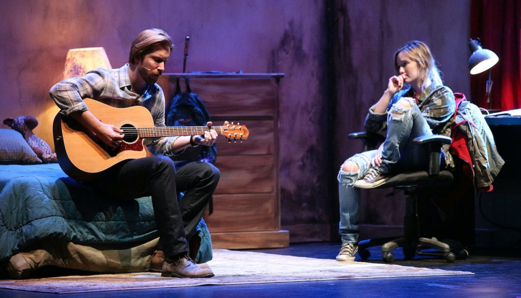 SANTA MONICA, CA - JULY 28: Actor Troy Baker (L) and actress Ashley Johnson perform a surprise alternative ending to The Last of US at The Broad Stage on July 28, 2014 in Santa Monica, California. (Photo by Imeh Akpanudosen/Getty Images for Sony Computer Entertainment America)