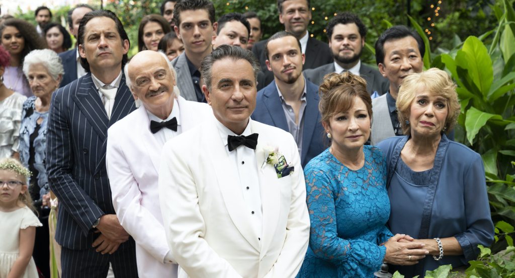Caption: (L back-R) ENRIQUE MURCIANO as Junior, RUBEN RABASA as Tio Walter (white tux),  SEAN PATRICK DAWSON as Junior, Jr., ANDY GARCIA as Billy, GLORIA ESTEFAN as Ingrid, HO-KWAN TSE as Huan (back) and MARTA VELASCO as Caridad “Chi Chi” Gonzalez in Warner Bros. Pictures' and HBO Max’s 