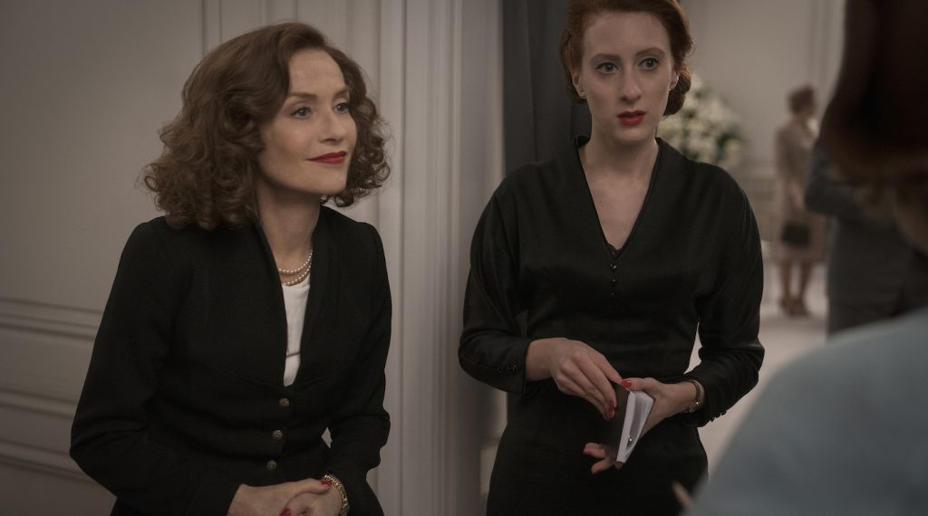 Isabelle Huppert stars as Claudine Colbert and Roxane Duran as Marguerite in director Tony Fabian’s MRS.HARRIS GOES TO PARIS, a Focus Features release. Credit: Dávid Lukács / © 2021 Ada Films Ltd - Harris Squared Kft