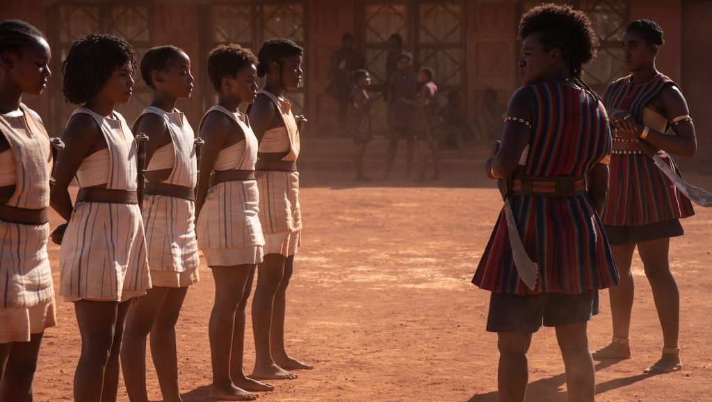 Viola Davis and Lashana Lynch with young recruits in THE WOMAN KING.