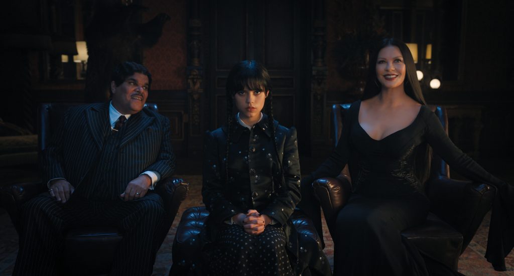 Wednesday. (L to R) Luis Guzmán as Gomez Addams, Jenna Ortega as Wednesday Addams, Catherine Zeta-Jones as Morticia Adams in episode 101 of Wednesday. Cr. Courtesy Of Netflix © 2022