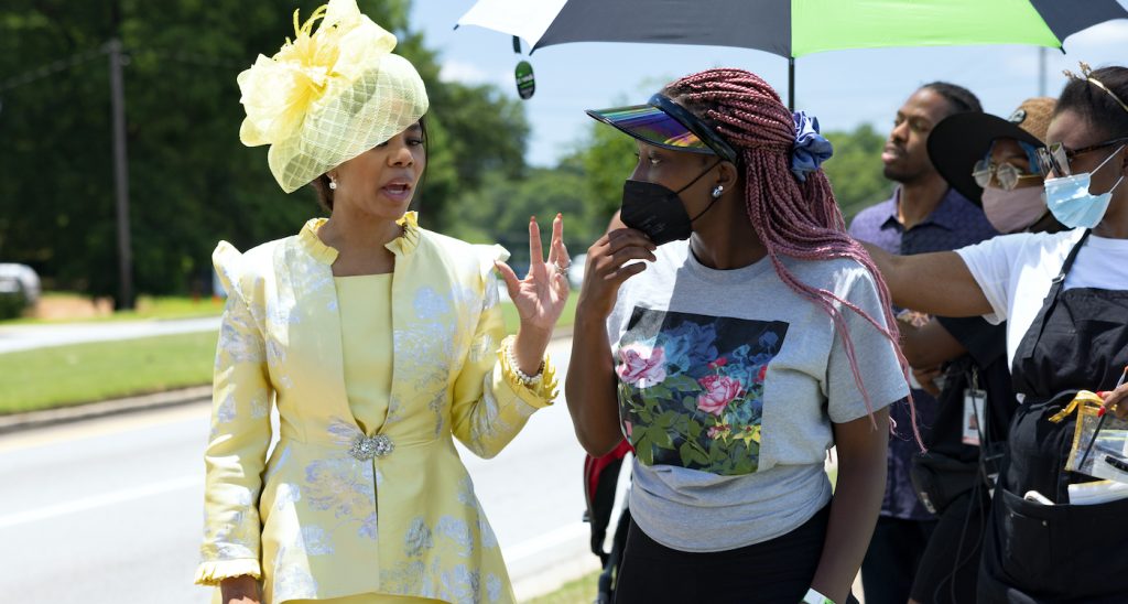 Actor Regina Hall and writer/director Adamma Ebo on the set of their film HONK FOR JESUS. SAVE YOUR SOUL., a Focus Features release. Credit: Steve Swisher / © 2021 Pinky Promise LLC