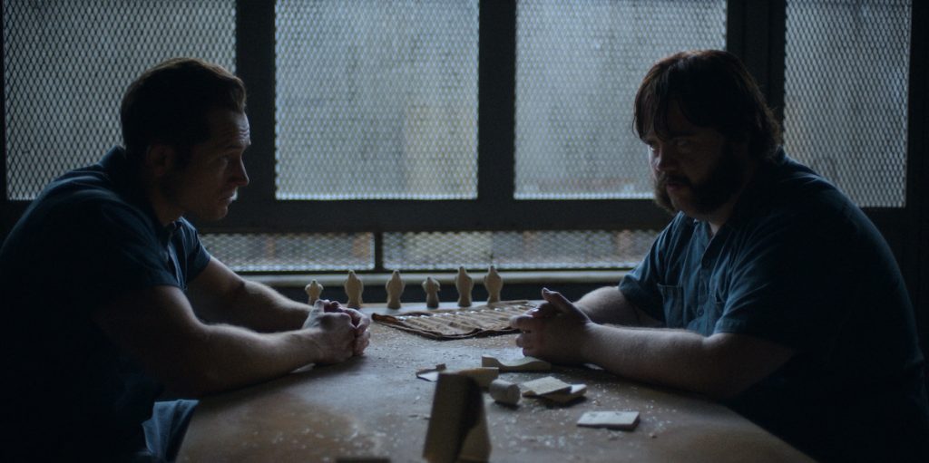 Taron Egerton and Paul Walter Hauser in “Black Bird,” now streaming on Apple TV+.