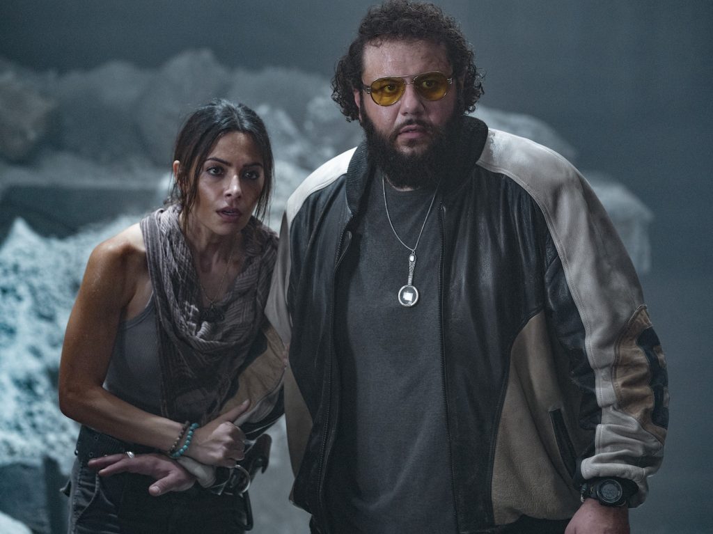 Caption: (L-r) SRAH SHAHI as Adrianna and MOHAMMED AMER as Karim in New Line Cinema’s action adventure “BLACK ADAM,” a Warner Bros. Pictures release. Photo Credit: Frank Masi