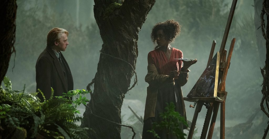 Guillermo del Toro's Cabinet of Curiosities. (L to R) Rupert Grint as Walter Gilman, Tenika Davis as Mariana in episode “Dreams in the Witch House” of Guillermo del Toro's Cabinet of Curiosities. Cr. Ken Woroner/Netflix © 2022