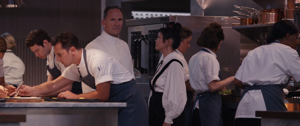 Ralph Fiennes and Hong Chau in THE MENU. Photo Courtesy of Searchlight Pictures. © 2022 20th Century Studios All Rights Reserved.