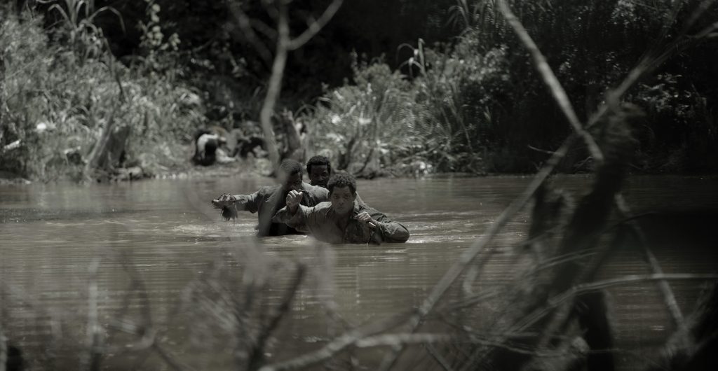 Will Smith, Michael Luwoye and Gilbert Owuor in "Emancipation," now streaming on Apple TV+.