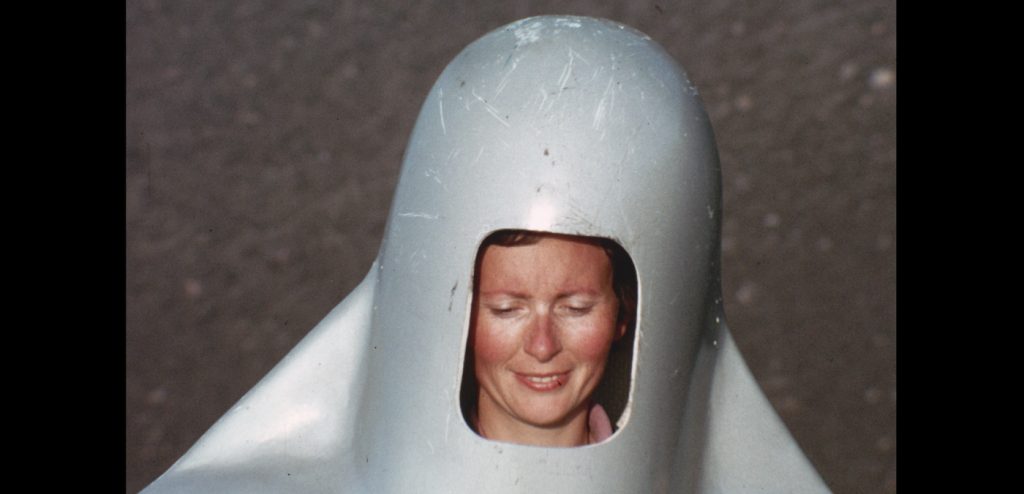 Katia smiles while putting on her giant metal helmet while on Mt Etna in 1972. (Credit: Image'Est)